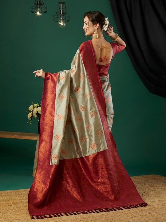 Chiku Banarasi Silk Woven Saree With Tassels on Pallu and Stitched Maroon Blouse