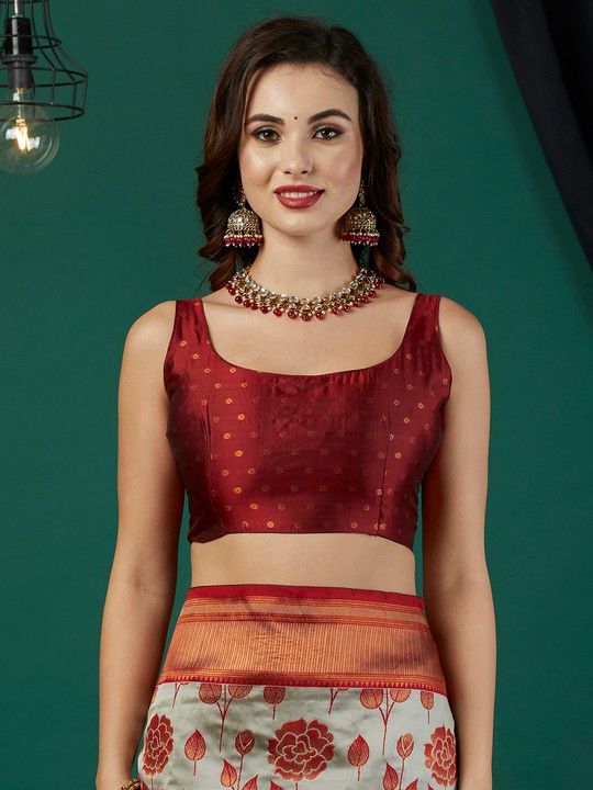 Grey Banarasi Silk Woven Saree With Tassels on Pallu and Stitched Rust Blouse