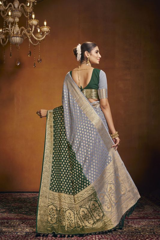 Green Georgette Woven Saree With Tassels on Pallu and Stitched Green Blouse