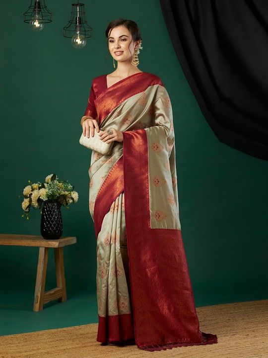 Chiku Banarasi Silk Woven Saree With Tassels on Pallu and Stitched Maroon Blouse