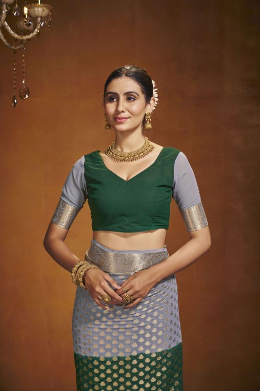 Green Georgette Woven Saree With Tassels on Pallu and Stitched Green Blouse