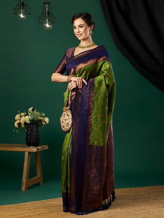 Green Banarasi Silk Woven Saree With Tassels on Pallu and Stitched Purple Blouse