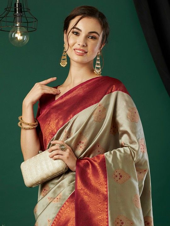 Chiku Banarasi Silk Woven Saree With Tassels on Pallu and Stitched Maroon Blouse
