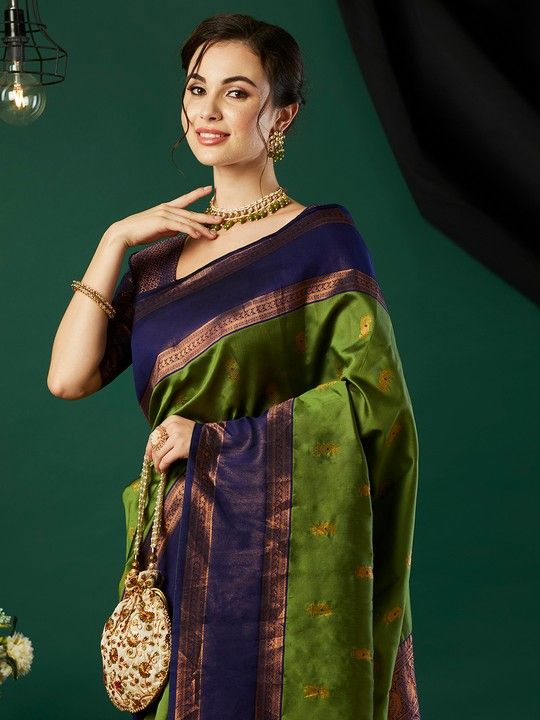 Green Banarasi Silk Woven Saree With Tassels on Pallu and Stitched Purple Blouse