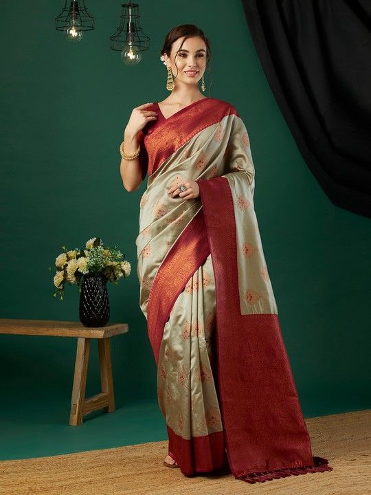 Chiku Banarasi Silk Woven Saree With Tassels on Pallu and Stitched Maroon Blouse