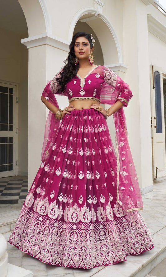 DARK PINK COLOR NET FABRIC LEHENGA CHOLI WITH SEQUINS AND THREAD EMBROIDERY WORK