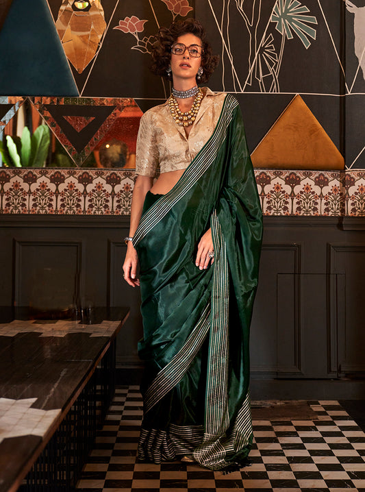 Dark green zari woven saree