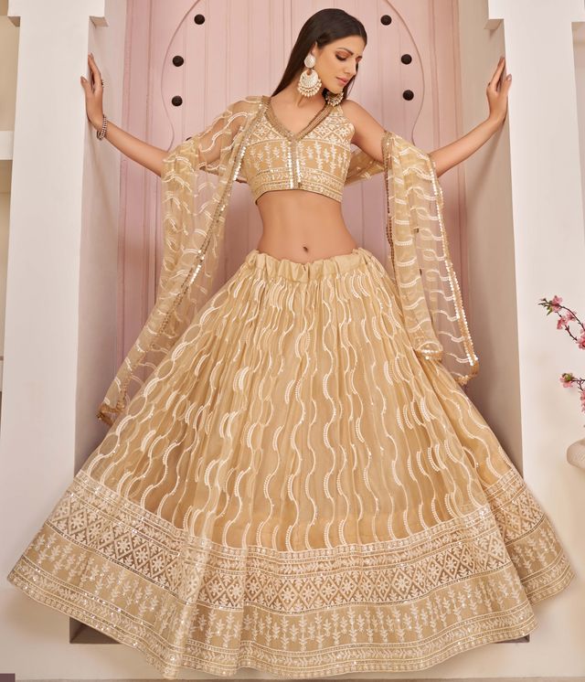 Beige embroidered net semi stitched lehenga