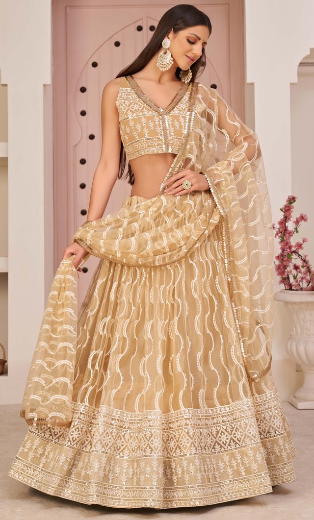 Beige embroidered net semi stitched lehenga