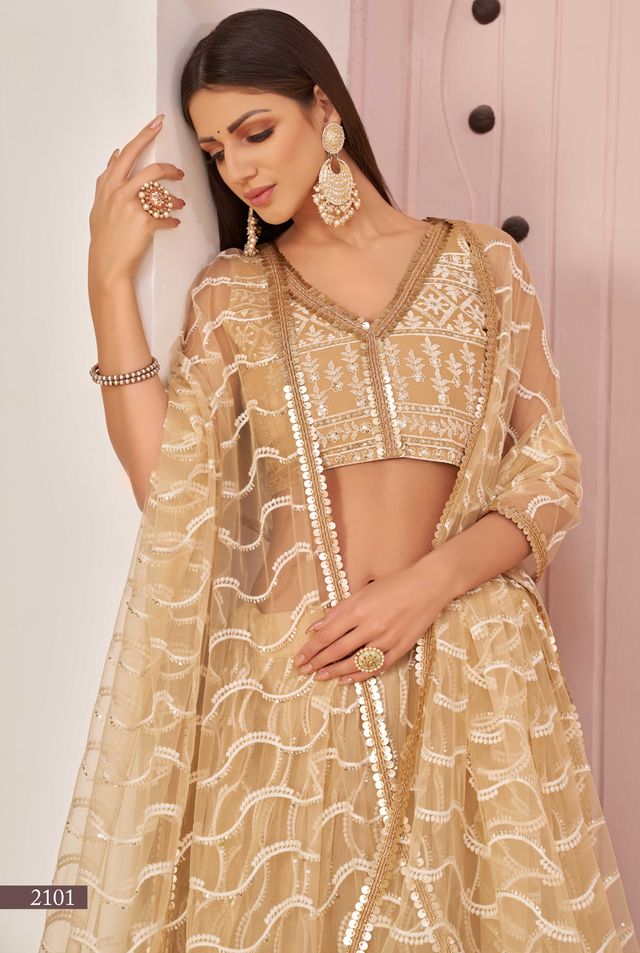 Beige embroidered net semi stitched lehenga