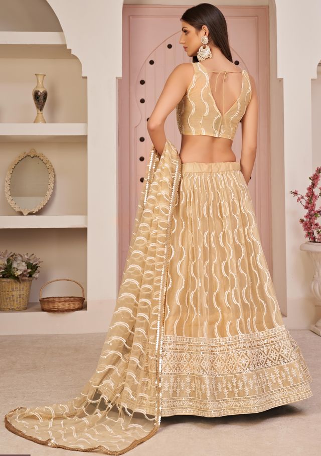 Beige embroidered net semi stitched lehenga