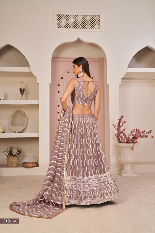 Pink embroidered net semi stitched lehenga