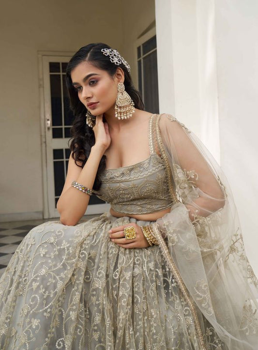 Ivory Color Net Fabric Lehenga Choli With Sequins And Thread Embroidery Work