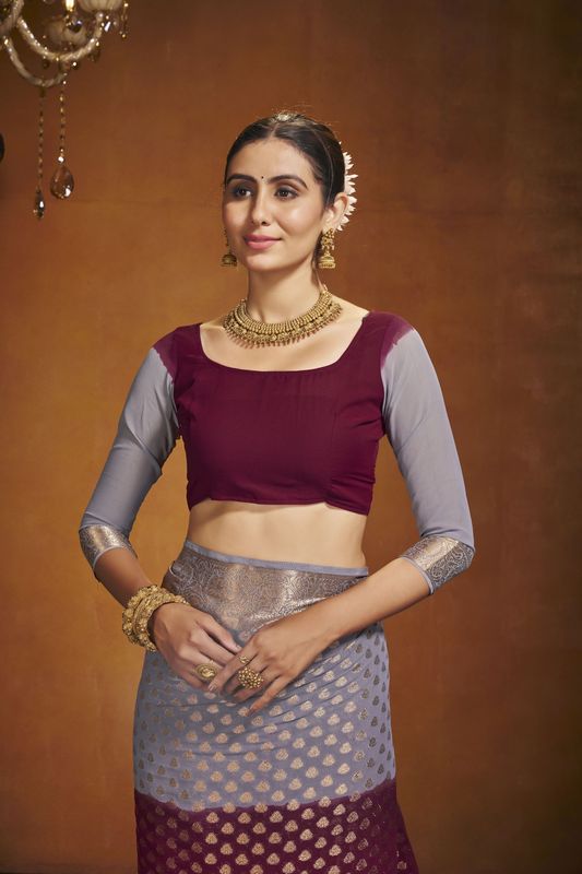 Maroon Georgette Woven Saree With Tassels on Pallu and Stitched Maroon Blouse