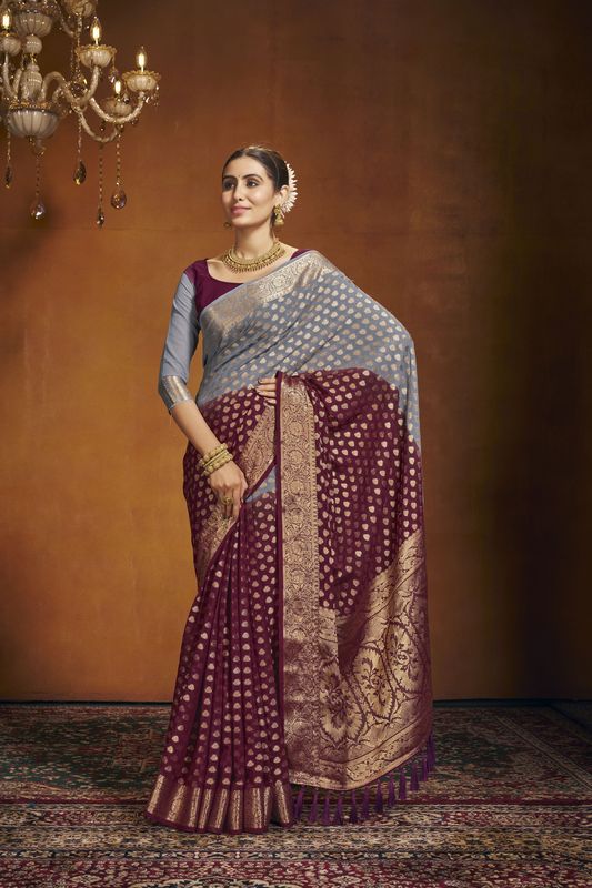 Maroon Georgette Woven Saree With Tassels on Pallu and Stitched Maroon Blouse